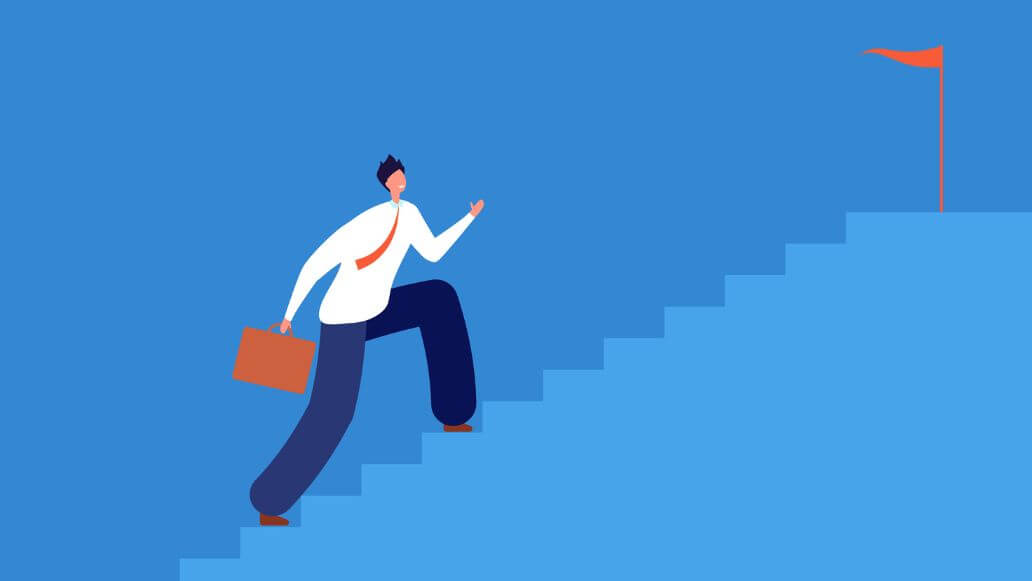 ゴールに向かって階段を上るビジネスパーソン