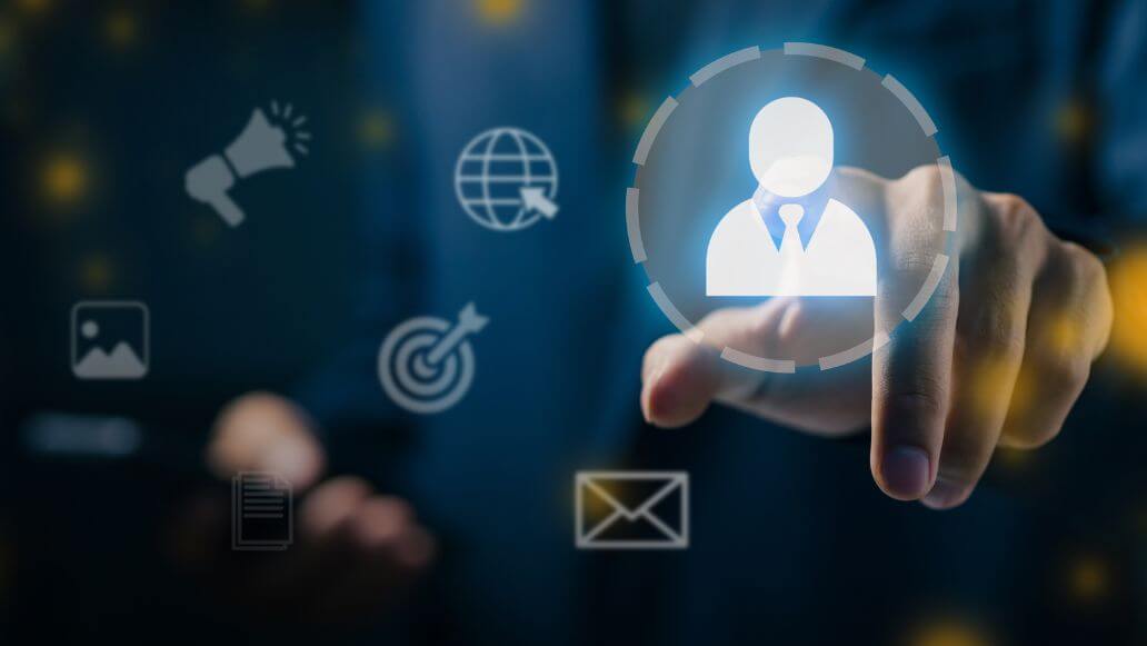 人物アイコンに触れるビジネスパーソン